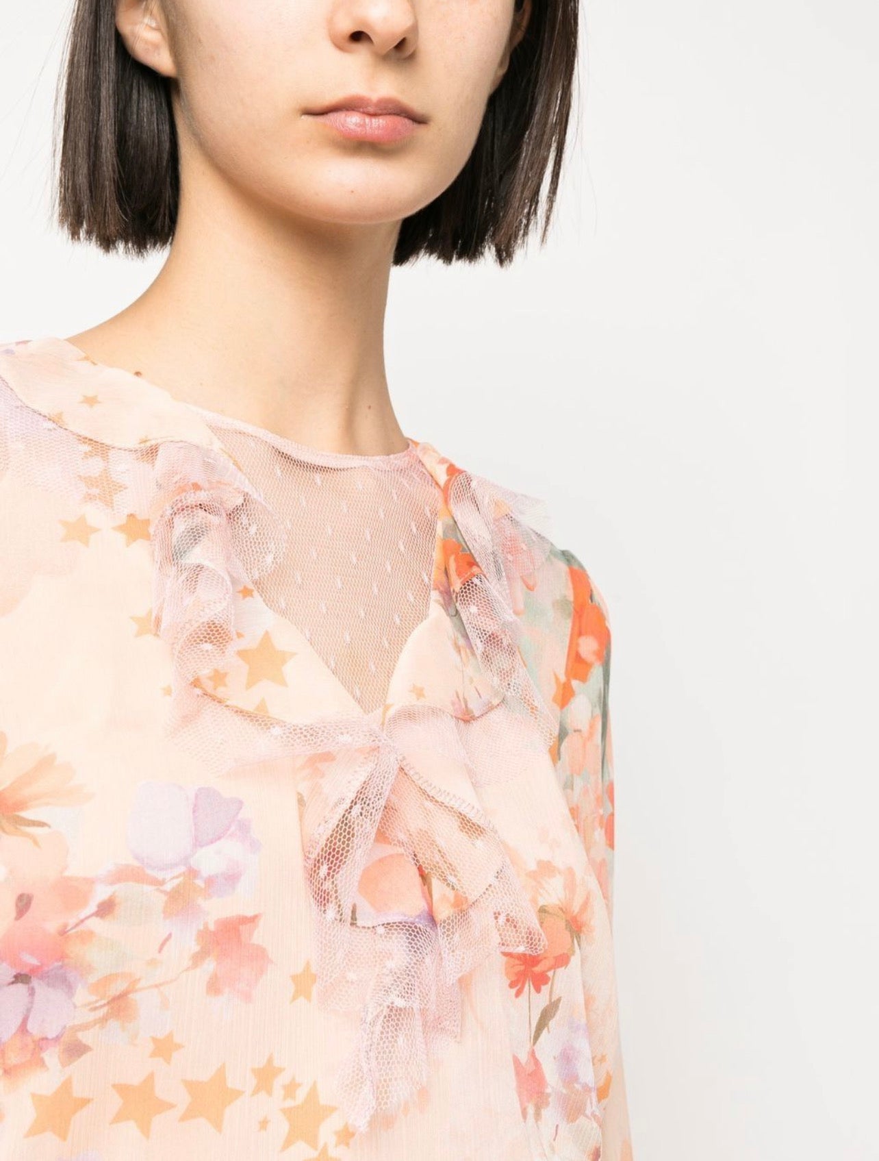Ruffled floral and star-print blouse
